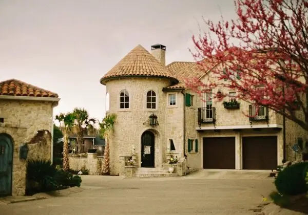 Stone-built Mediterranean style house with lush surroundings in Dallas, Texas.