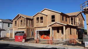Wooden frames of new houses under construction in Elk Grove subdivision.