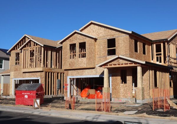 Wooden frames of new houses under construction in Elk Grove subdivision.
